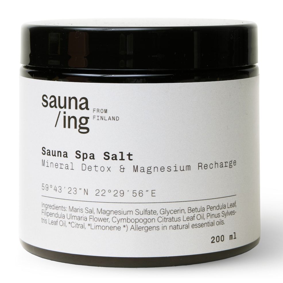 A black 200ml jar of sauna/ing Sauna Spa Salt by sauna/ing features a white label with product details and ingredients—ideal for a detoxifying bath or relaxing foot soak.