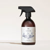 A SEES Company SEES x Moomin Dish Wash Spray, in a brown bottle with cartoon animals and plants, is shown against a light background. This biodegradable dishwashing liquid provides an eco-friendly clean.