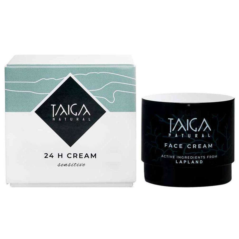 A jar and box of Taiga Cosmetics 24 H Cream Sensitive, with minimalist white and teal design, showcase this nourishing face cream made with natural Lapland ingredients for sensitive skin.