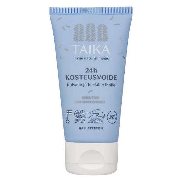 A blue tube labeled Taika Sensitive 24h Moisturiser features Finnish text indicating it is a fragrance-free moisturiser for dry, sensitive skin. The design includes leaf illustrations and vegan/natural certification symbols.