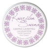 A round tin labeled Kaurilan Sauna Gentle Lavender Foot Cream, handmade in Helsinki, features decorative lavender flowers around the edge and text in Finnish and English.