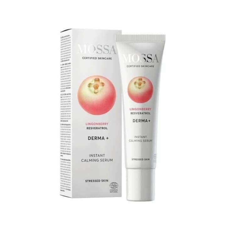 A tube of Mossa Derma+ Instant Calming Serum for sensitive skin stands beside its box. Both display a lingonberry graphic with product details in black and red on white. Now formulated with hyaluronic acid for added hydration.