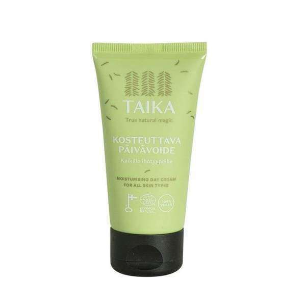 A light green tube of Taika Day Cream for all skin types, enriched with organic birch sap. Features white Finnish and English text, small leaf patterns, a black flip-top cap, and eco-certification icons for vegan skincare.
