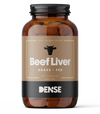 A brown bottle labeled DENSE Beef Liver by DENSE contains 180 grass-fed beef liver capsules (400 mg), features a cow head icon above the name, and “DENSE” at the bottom—premium freeze-dried organ supplements for wellness.