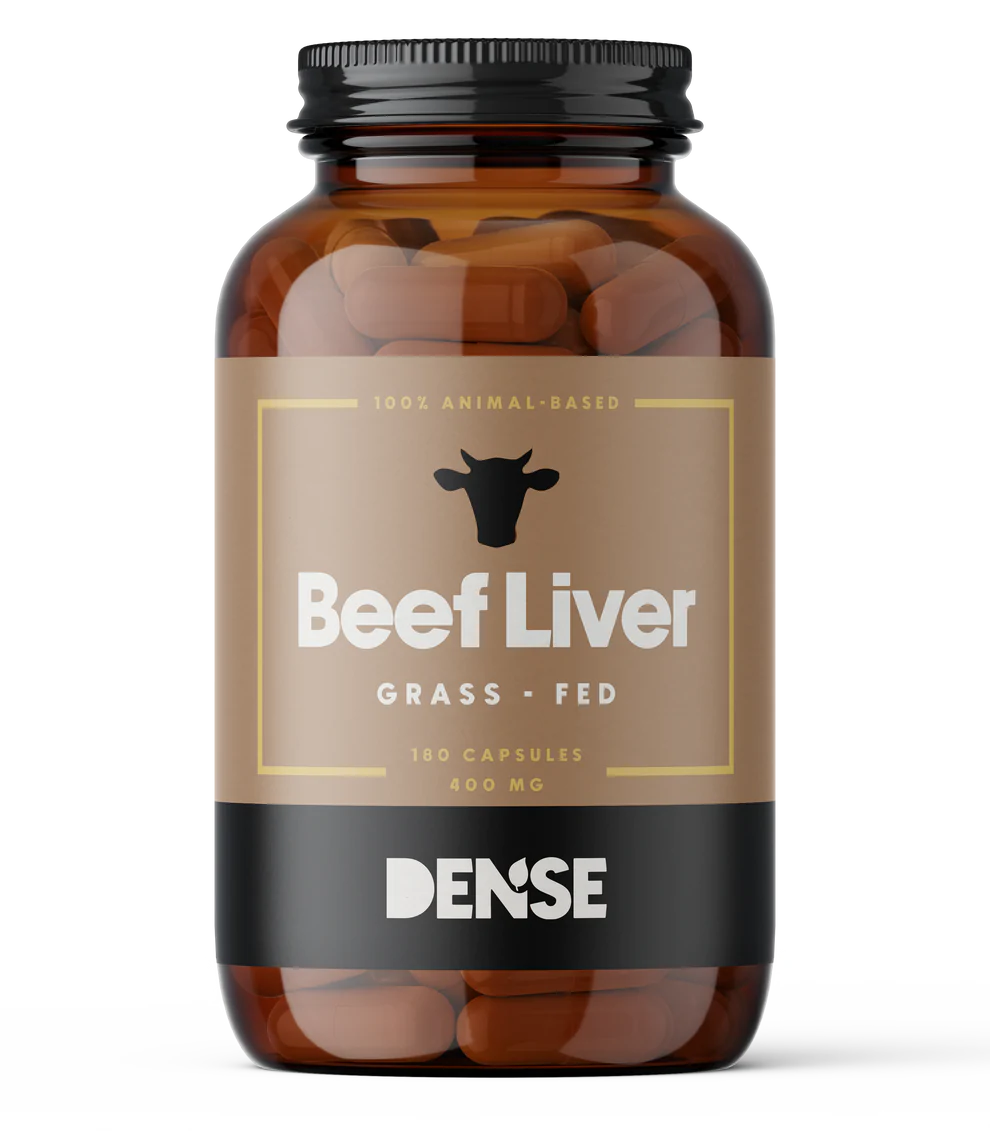 A brown bottle labeled DENSE Beef Liver by DENSE contains 180 grass-fed beef liver capsules (400 mg), features a cow head icon above the name, and “DENSE” at the bottom—premium freeze-dried organ supplements for wellness.