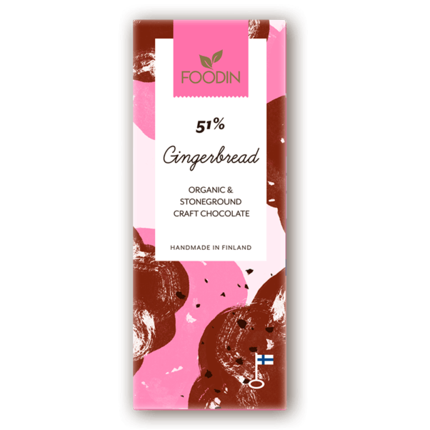 A chocolate bar with a pink and brown abstract wrapper labeled Foodin Organic Raw Chocolate Gingerbread 51%, made with organic spices and coconut sugar, handmade in Finland, featuring a small Finnish flag.