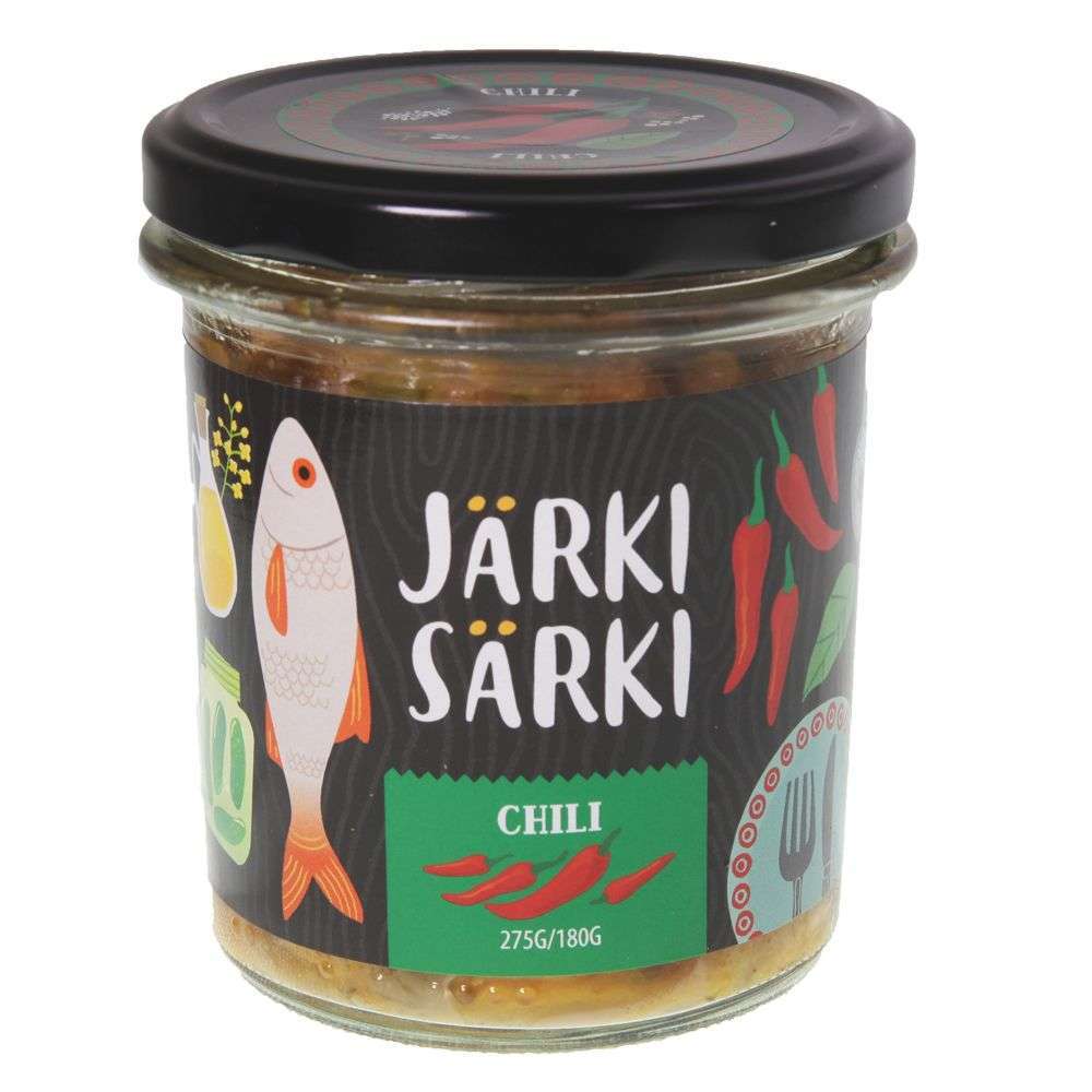 A 275g glass jar of Järki Särki Chili by Järki Särki, a Finnish delicacy with Särki fish and omega-3 oils. The black label shows a fish, red chili peppers, food icons, and white-green text. The jar has a black lid.