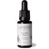 A small dark bottle with a dropper cap labeled Laponie of Scandinavia Calming Treatment Serum, 20 ml, a serum for sensitive skin by Laponie of Scandinavia, is displayed against a white background.