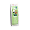 A light green bag of Nordqvist Moominmamma’s Magic Potion loose leaf tea features adorable Moomin artwork, a tea cup illustration, and Finnish text. Enjoy delightful rhubarb and strawberry notes against a white background. Brand: Nordqvist.