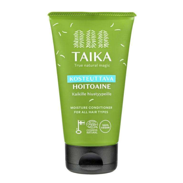 A green tube of Taika Conditioner for all hair types, decorated with white tree icons and bilingual text, highlights its COSMOS natural certification and 100% vegan formula.