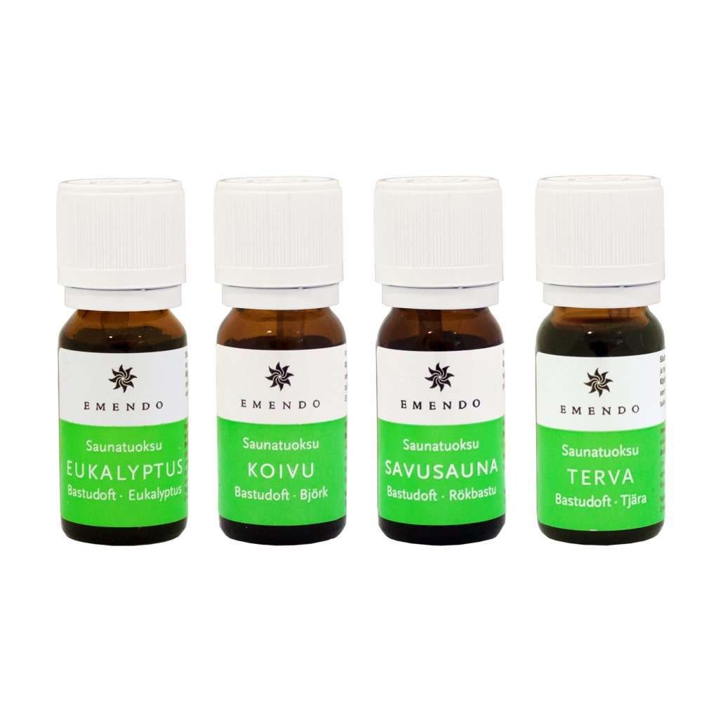 Four Emendo Sauna Fragrance bottles—Eucalyptus, Birch, Smoke Sauna, and Tar—stand in a row. Each has a green label and white cap. Made in Finland by Emendo, they’re set against a white background.