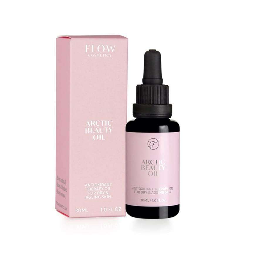 A pink box labeled FLOW Cosmetics Arctic Beauty Oil stands next to a small dark glass dropper bottle with a matching pink label. This 30ml anti-aging serum, rich in arctic berry seed oils, is ideal for sensitive skin.