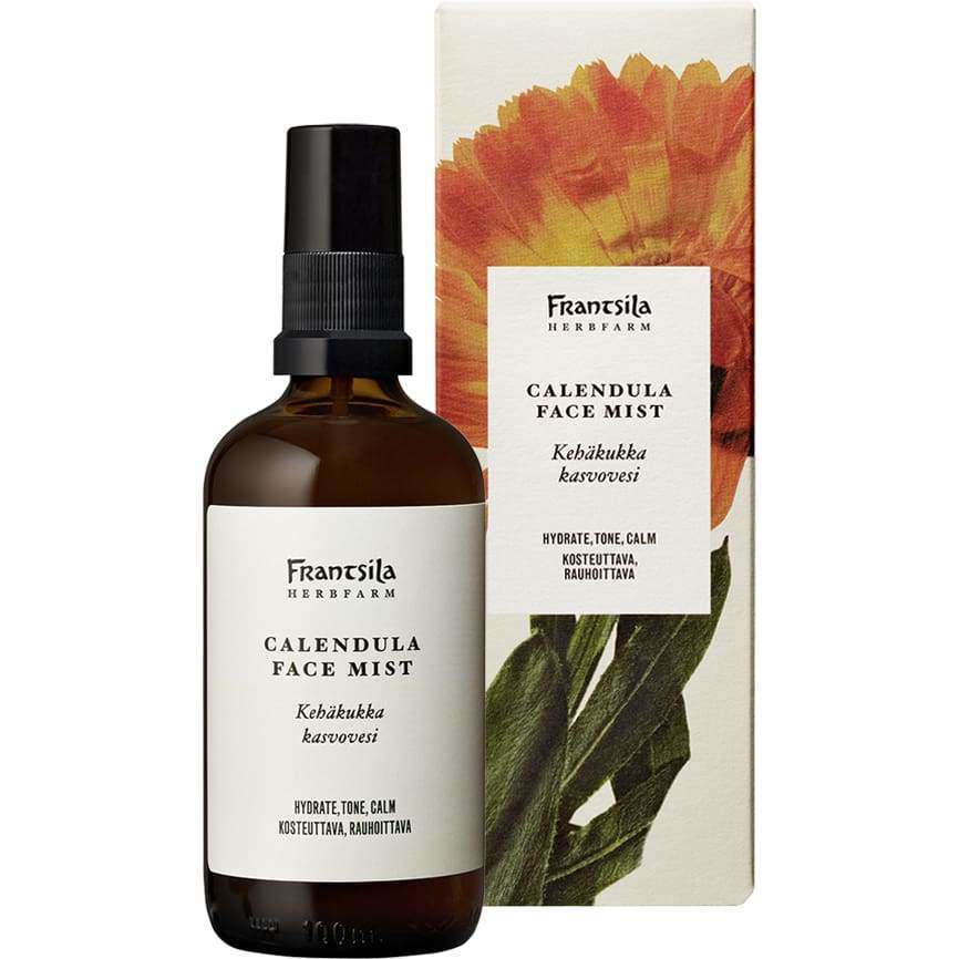 A brown spray bottle of Frantsila Calendula Face Mist stands before its box, adorned with an orange calendula flower. This toner from Frantsila hydrates, tones, and soothes skin for a calming facial mist experience.